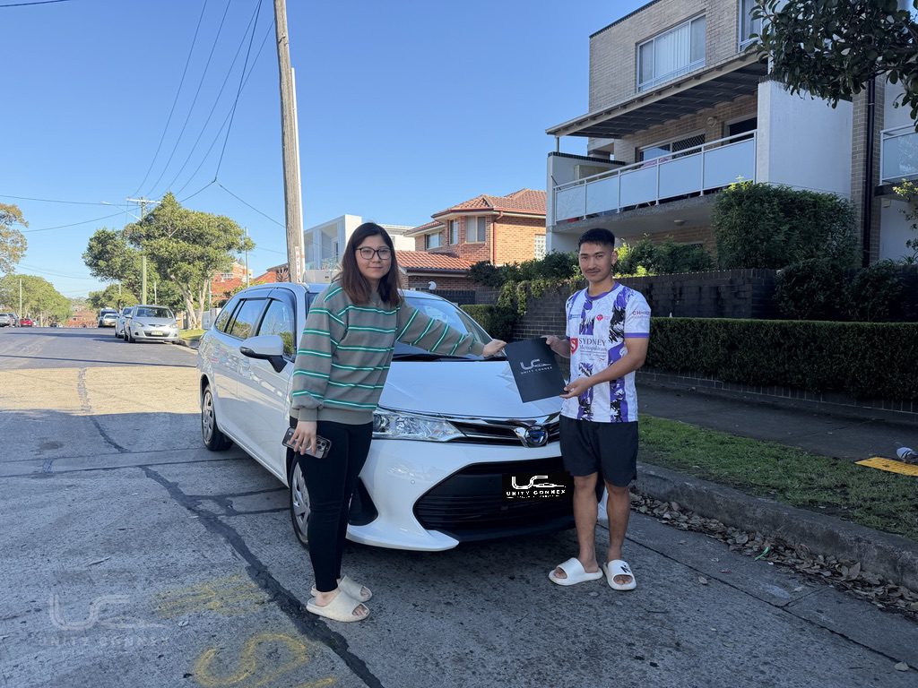 Yangchen celebrating delivery of Toyota Corolla Fielder at Unity Connex — photo 2 of 2